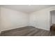 A bedroom with wood-look flooring, a door and white walls at 3409 Ashridge Way, Conway, SC 29526