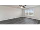 Bright bedroom with dark gray vinyl flooring and a ceiling fan at 3410 Ashridge Way, Conway, SC 29526