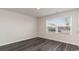 Well-lit bedroom featuring gray vinyl flooring and a large window at 3410 Ashridge Way, Conway, SC 29526