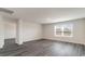 Spacious bonus room with dark gray vinyl plank flooring and large window at 3410 Ashridge Way, Conway, SC 29526