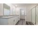 Double vanity bathroom with granite countertop and shower at 3415 Ashridge Way, Conway, SC 29526