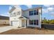 Two-story house with white siding, maroon shutters, and a double garage at 3415 Ashridge Way, Conway, SC 29526