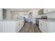 Kitchen island with granite countertop and white cabinets at 3415 Ashridge Way, Conway, SC 29526