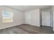 Bedroom with grey vinyl plank flooring and window at 3433 Ashridge Way, Conway, SC 29526