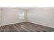 Bright bedroom with grey vinyl plank flooring and window at 3433 Ashridge Way, Conway, SC 29526