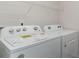 Laundry room with Whirlpool washer and dryer, and overhead shelving at 3434 Ashridge Way, Conway, SC 29526