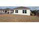 A fenced in backyard with immature lawn, showing the back of a house at 3438 Ashridge Way, Conway, SC 29526