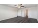 Spacious bedroom with modern ceiling fan, luxury vinyl plank flooring, and two closets at 3439 Ashridge Way, Conway, SC 29526