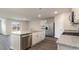 Kitchen island with granite countertop, stainless steel dishwasher, and white cabinets at 3465 Ashridge Way, Conway, SC 29526