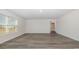 Spacious bedroom with wood-look floors and large window at 3473 Ashridge Way, Conway, SC 29526