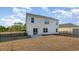 Rear view of a two-story house with a patio and fenced backyard at 3488 Ashridge Way, Conway, SC 29526