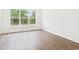 Bedroom with large windows offering natural light and backyard views at 35 Northbrook Dr, Murrells Inlet, SC 29576