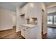 Butler's pantry with a countertop, white cabinets, and decorative tile backsplash at 35 Northbrook Dr, Murrells Inlet, SC 29576