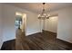 Hardwood floors in a dining room with a chandelier at 35 Northbrook Dr, Murrells Inlet, SC 29576