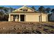 Two-story craftsman style home with beige exterior and two-car garage at 35 Northbrook Dr, Murrells Inlet, SC 29576