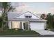 Gray exterior two-story home with white accents and two-car garage at 35 Northbrook Dr, Murrells Inlet, SC 29576