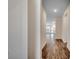 Hallway featuring hardwood floors, white walls, and a clear view of the home's open layout at 35 Northbrook Dr, Murrells Inlet, SC 29576