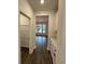 Hallway with hardwood floors leading to the dining area at 35 Northbrook Dr, Murrells Inlet, SC 29576