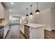 Gourmet kitchen boasts stainless appliances, quartz countertops and pendant lighting at 35 Northbrook Dr, Murrells Inlet, SC 29576