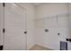 Convenient laundry room with wire shelving, tile flooring, and utility connections at 35 Northbrook Dr, Murrells Inlet, SC 29576