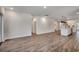 Open-concept living room flows into the kitchen and features recessed lighting and wood floors at 35 Northbrook Dr, Murrells Inlet, SC 29576