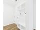 Well-organized mudroom with bench seating, storage shelves and coat hooks at 35 Northbrook Dr, Murrells Inlet, SC 29576