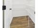 Pantry room with wood-look flooring and ample white wire shelving at 35 Northbrook Dr, Murrells Inlet, SC 29576