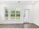 Bright sunroom has multiple windows and a glass door with backyard views at 35 Northbrook Dr, Murrells Inlet, SC 29576