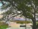 Picturesque waterfront view with an oak tree in the foreground, dock, and scenic marshland at 35 Northbrook Dr, Murrells Inlet, SC 29576