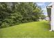 Wooded backyard with green grass at 363 Junco Circle, Longs, SC 29568