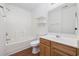 Clean bathroom with a shower/tub combo, wood vanity, and floating shelves at 363 Junco Circle, Longs, SC 29568