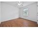 Simple bedroom with wood-look flooring and a window offering natural light at 363 Junco Circle, Longs, SC 29568