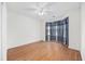 Well-lit bedroom featuring bay window, wood-look flooring and ceiling fan at 363 Junco Circle, Longs, SC 29568