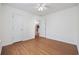 Bedroom with wood-look flooring, a closet, and access to another room at 363 Junco Circle, Longs, SC 29568