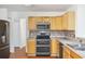 Well-equipped kitchen with wood cabinets and stainless steel appliances at 363 Junco Circle, Longs, SC 29568