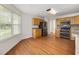 Eat-in kitchen with wood cabinets, stainless steel appliances and tile backsplash at 363 Junco Circle, Longs, SC 29568