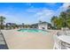 Community pool with surrounding patio and seating at 409 Carrick Loop, Longs, SC 29568