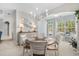 Charming dining room featuring a round table, chandelier, and sunlit space at 409 Carrick Loop, Longs, SC 29568