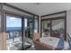A private balcony includes seating and sliding glass doors with ocean views at 4103 N Ocean Blvd. # 504, North Myrtle Beach, SC 29582