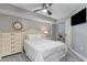 This bedroom features neutral colors, an abundance of natural light, and a flat-screen TV at 4103 N Ocean Blvd. # 504, North Myrtle Beach, SC 29582