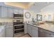 Modern kitchen with stainless steel appliances, granite countertops, and an open layout ideal for entertaining at 4103 N Ocean Blvd. # 504, North Myrtle Beach, SC 29582
