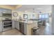 Open-concept kitchen with stainless steel appliances, a breakfast bar, and seamless connection to living spaces at 4103 N Ocean Blvd. # 504, North Myrtle Beach, SC 29582