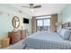 This is a light and airy main bedroom with water view and a flat-screen TV at 4103 N Ocean Blvd. # 504, North Myrtle Beach, SC 29582