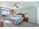 Bright main bedroom featuring a ceiling fan, balcony access, and coastal decor at 4103 N Ocean Blvd. # 504, North Myrtle Beach, SC 29582