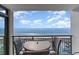 Balcony with table and chairs overlooking the ocean at 4103 N Ocean Blvd. # 504, North Myrtle Beach, SC 29582