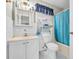 Well-lit bathroom with a tub-shower combo, large vanity, and ample storage space at 412 Chesterfield Ct., Myrtle Beach, SC 29577
