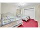 Comfortable bedroom with twin beds, red carpet and ample closet space at 412 Chesterfield Ct., Myrtle Beach, SC 29577