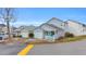 Gray house with white trim and a small porch at 412 Chesterfield Ct., Myrtle Beach, SC 29577