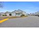 Charming home with a white picket fence, lovely front porch, and attached garage, creating a welcoming curb appeal at 412 Chesterfield Ct., Myrtle Beach, SC 29577