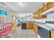 Efficient kitchen with black appliances, granite countertops, tile floors and an adjacent dining area at 412 Chesterfield Ct., Myrtle Beach, SC 29577
